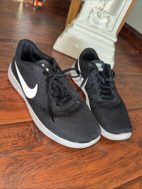 Nike Girl’s Black Athletic Sneakers with White Swoosh
